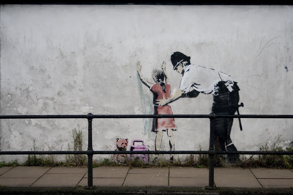 Banksy's 'Policeman Searching'